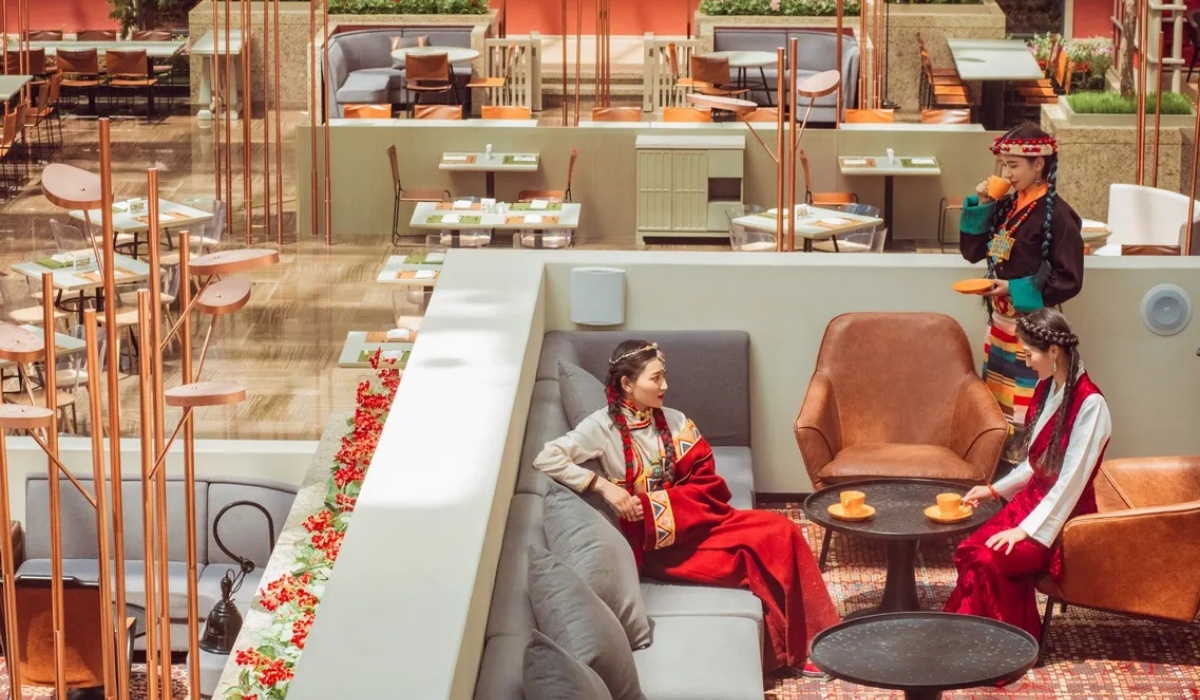 Guests in Tibetan dress at atrium lounge