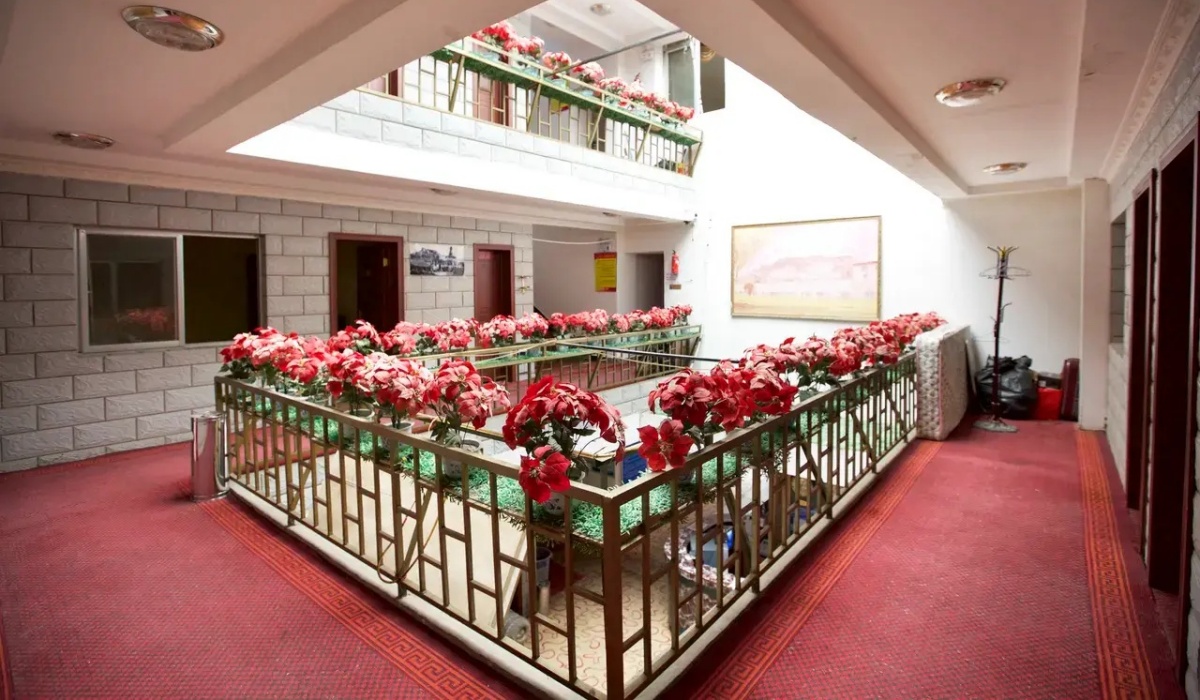 Flower-decorated corridor inside Lhasa Jinfan Hotel