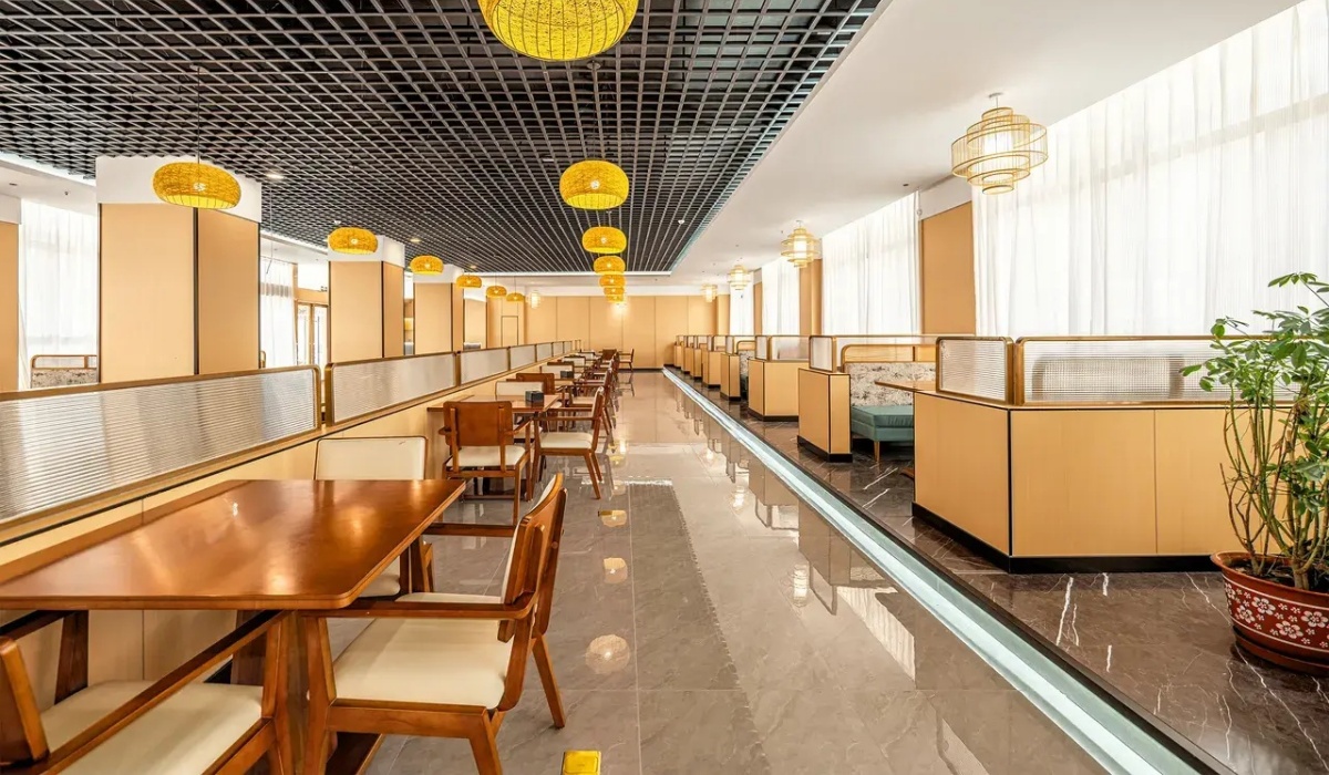 Hotel dining area with wooden tables and chairs