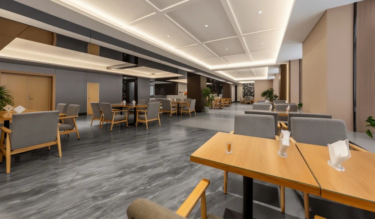 Modern hotel dining area with tables and chairs