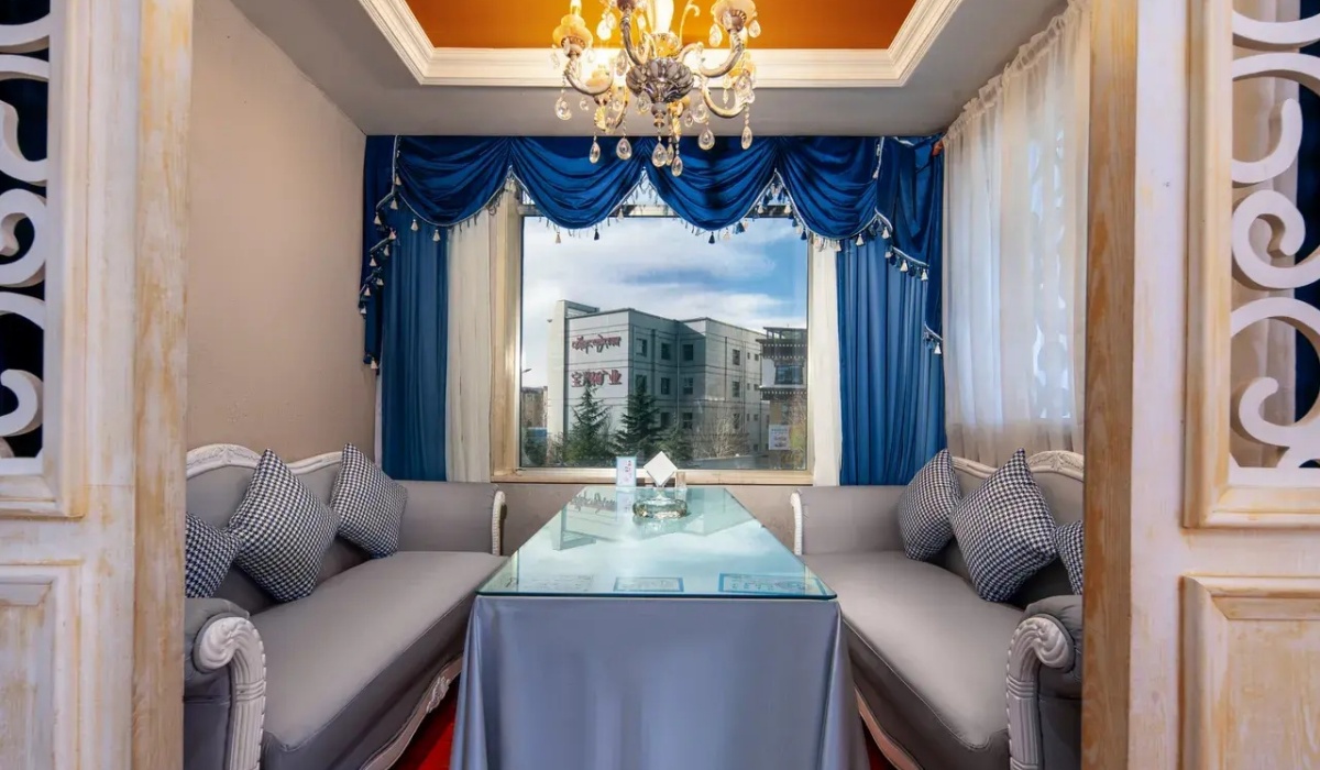 Cozy private dining booth with plush sofa seating