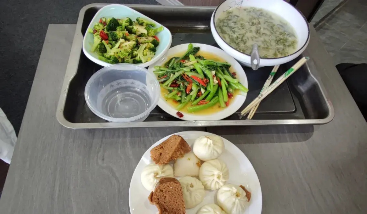 Nutritious hotel breakfast tray with steamed buns and soup
