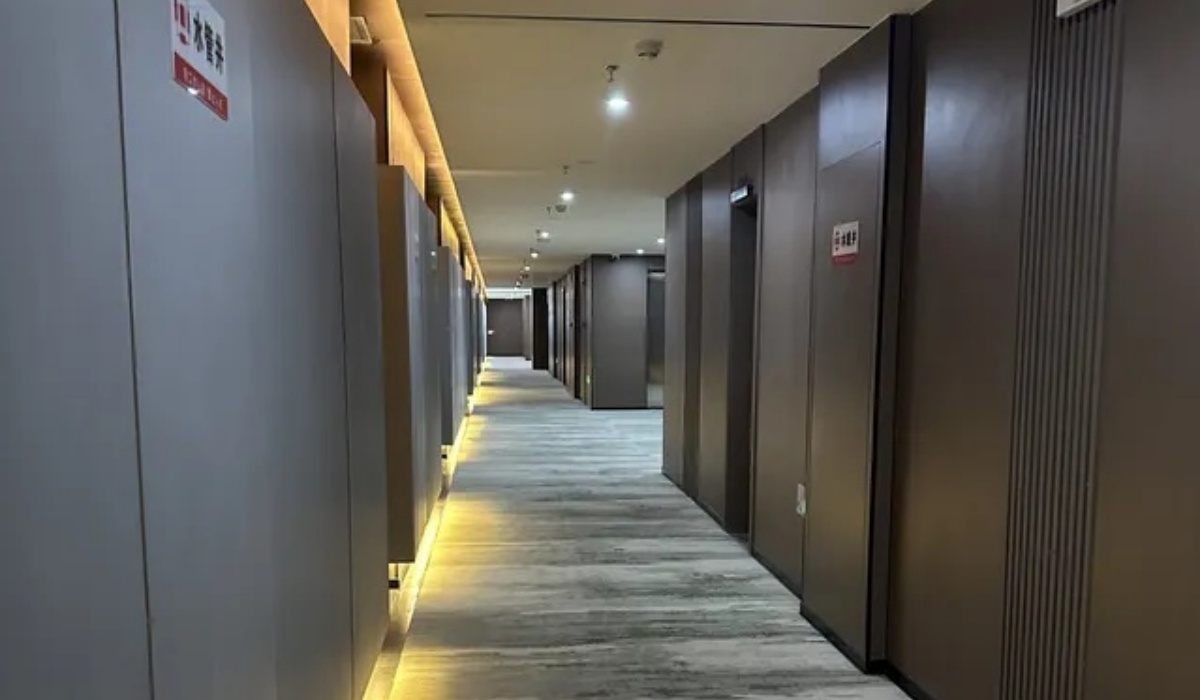 Modern well-lit guest hallway at Western Inn Sheli Hotel