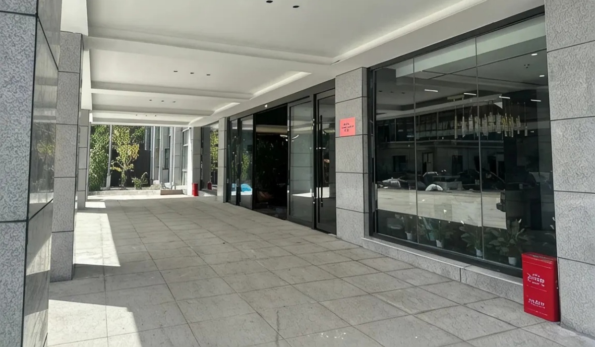 Exterior entrance and glass canopy at Western Inn Sheli Hotel