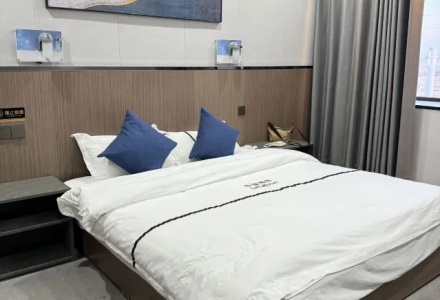 Comfortable king size bed in guest room at Letu Hotel Darchen