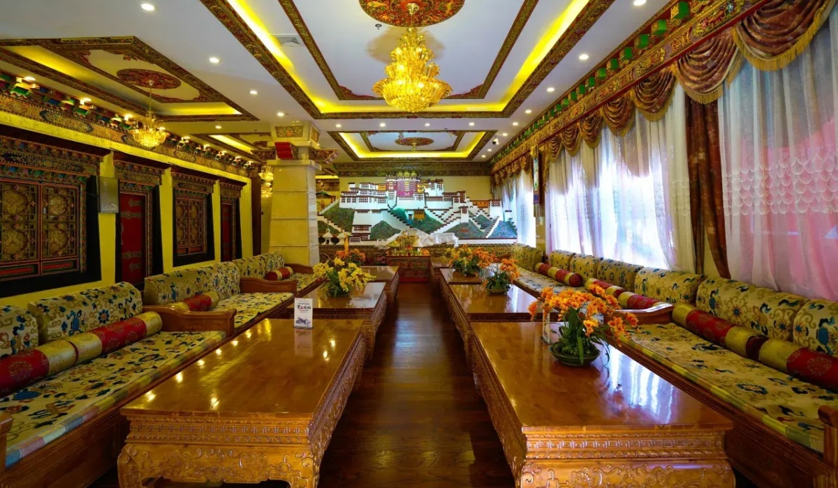 Spacious lobby lounge with Tibetan sofas and chandeliers