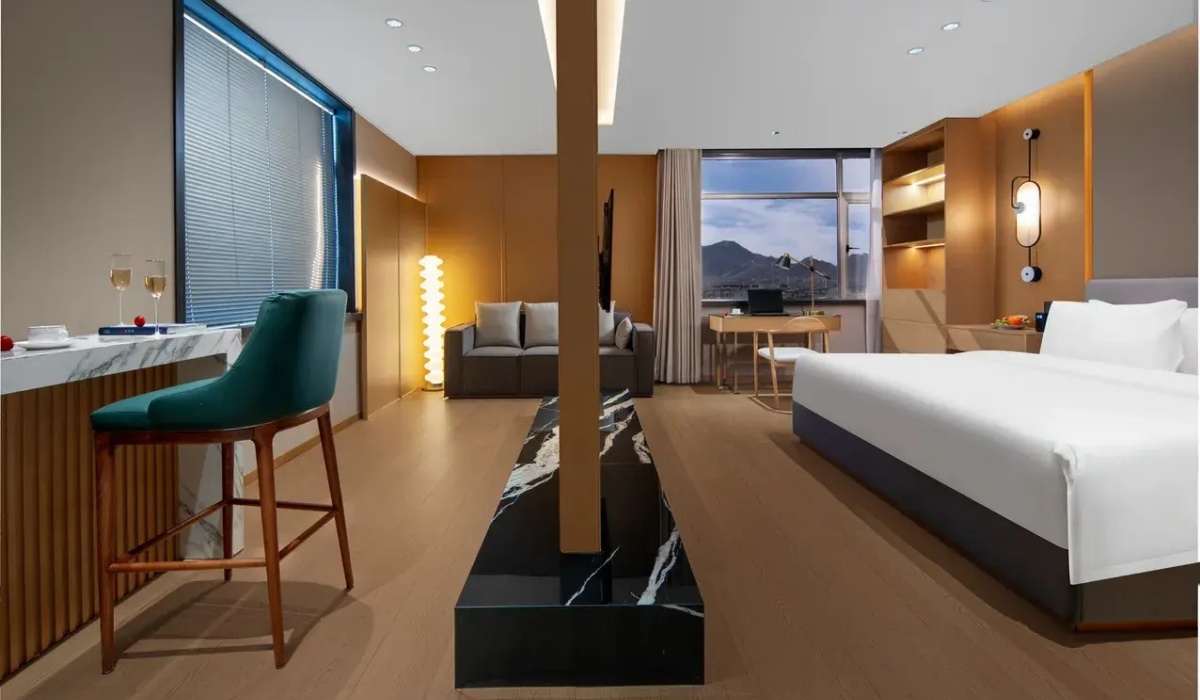 Luxury hotel suite with living area and mountain view