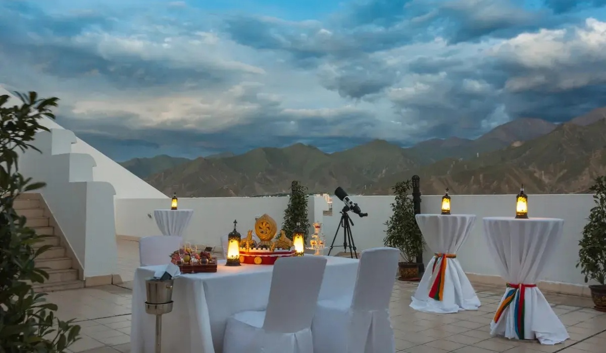 Outdoor dining area at InterContinental Lhasa Paradise with mountain views