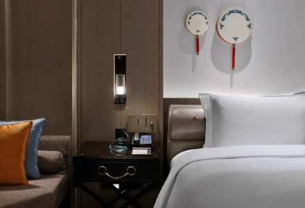 Bedside table showing light controls and high-altitude oxygen supply inlet