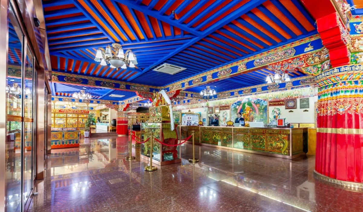 Main reception front desk in Tibetan decorated lobby at Gesar Hotel