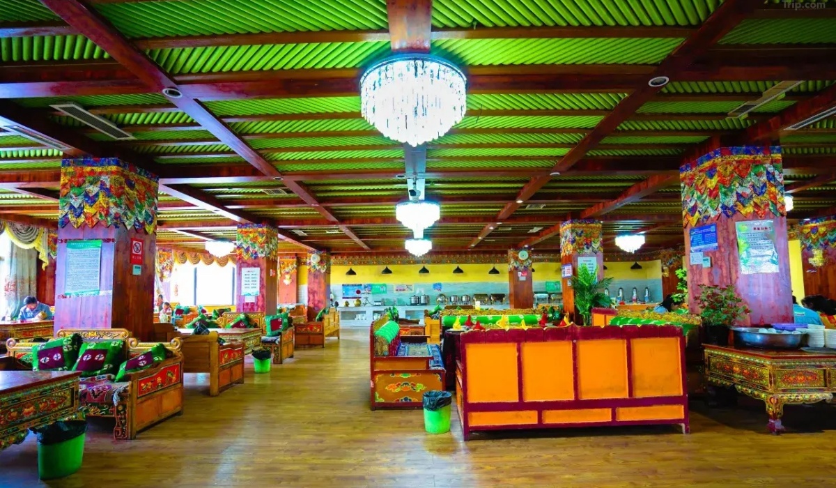 Spacious hotel restaurant with traditional Tibetan seating