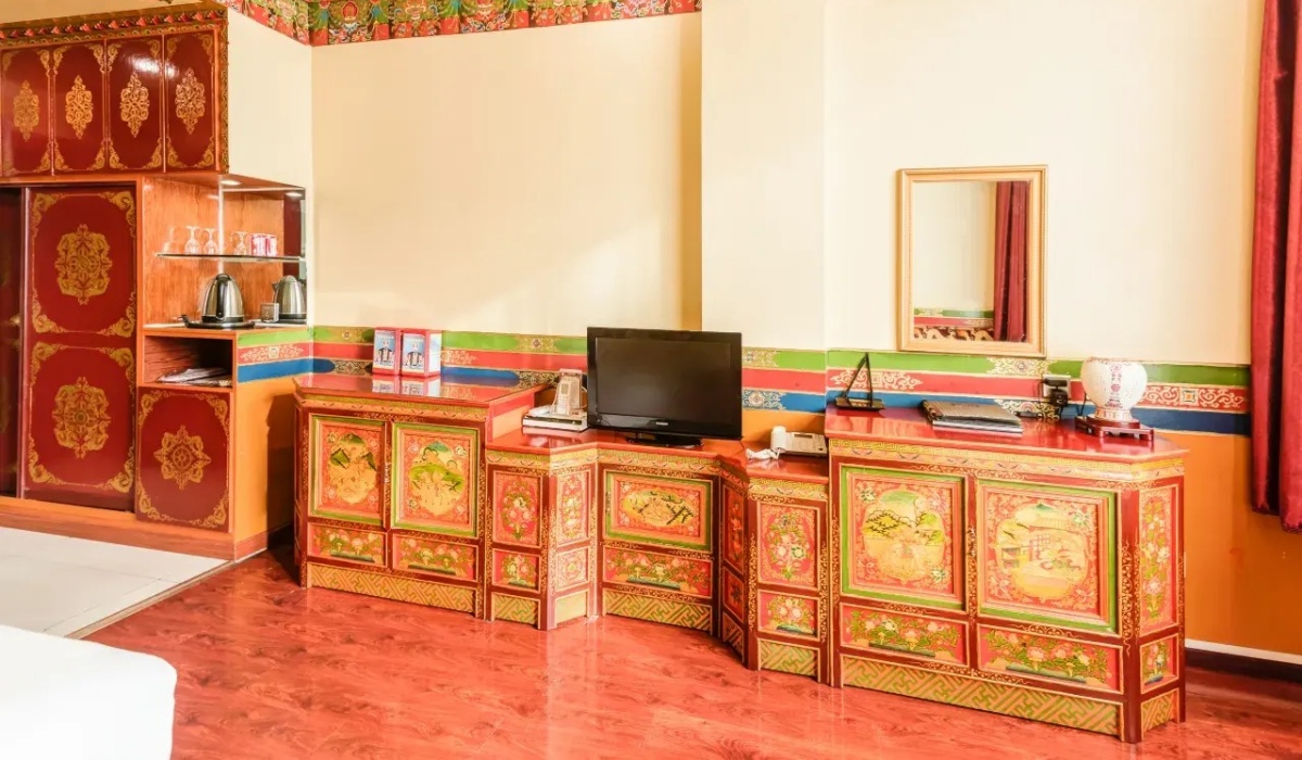 Tibetan carved TV cabinet and vanity desk inside guest room