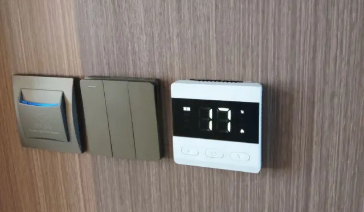 Digital wall thermostat control panel in guest room at Letu Hotel
