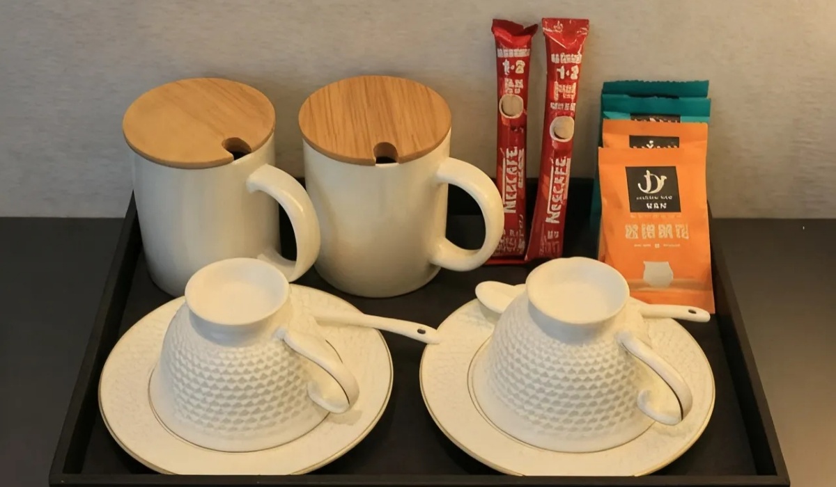 Complimentary tea cups and coffee packets in room