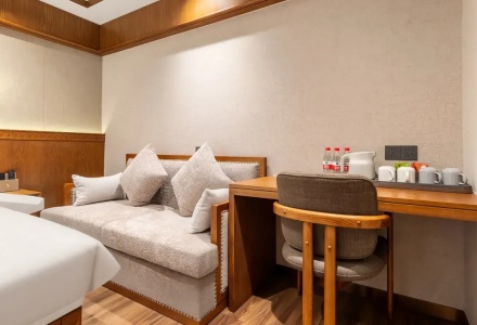 Seating area inside a guest room at Lhasa Yak Hotel
