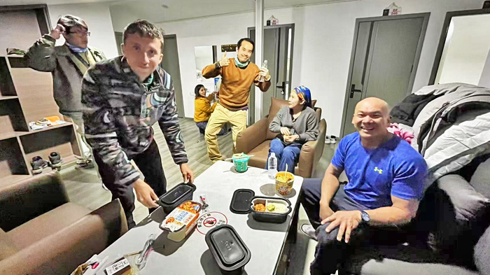 Travelers relaxing in the shared living area of the Everest Base Camp Tent Hotel