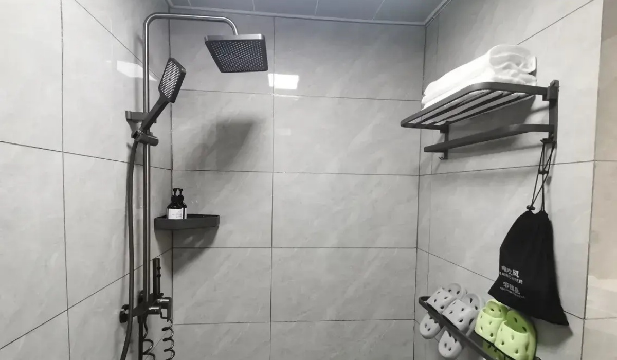 Clean shower room with dark grey fixtures at Shenling Mountain Hotel