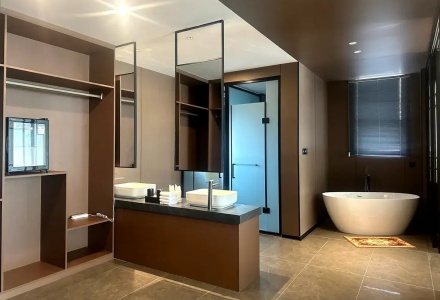 Spacious bathroom with freestanding bathtub at Western Inn Sheli Hotel