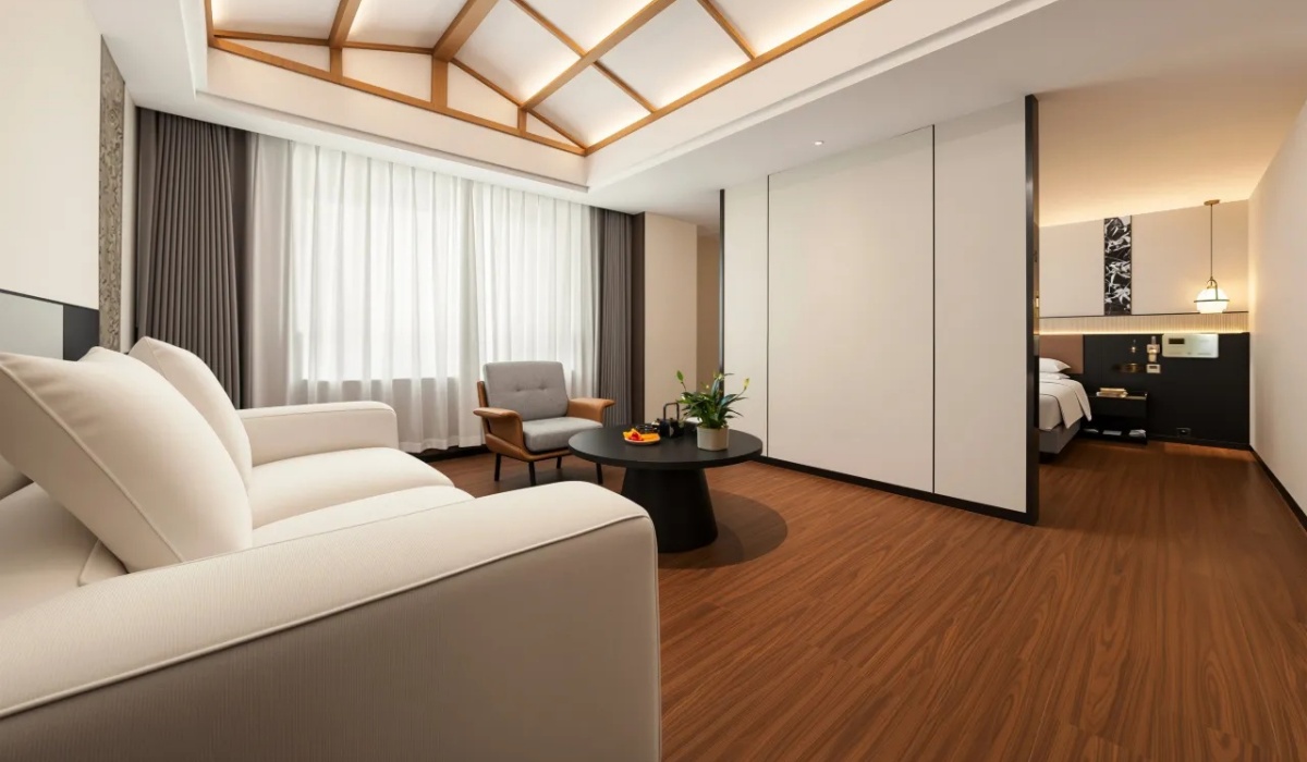 Zen-style suite bedroom with white cozy sofa