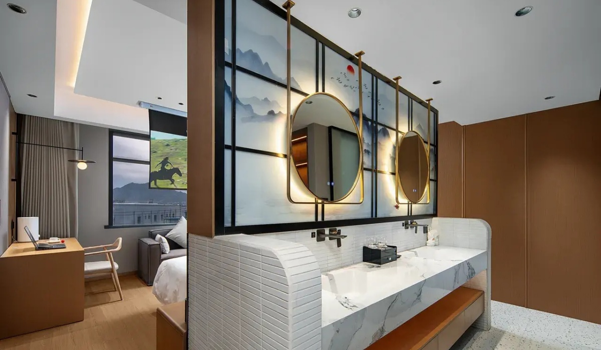 Suite bathroom double vanity with illuminated round mirrors