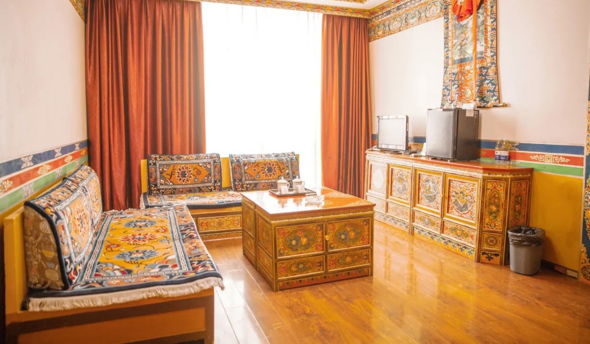 Cozy suite living room with Tibetan wooden furniture and tea table