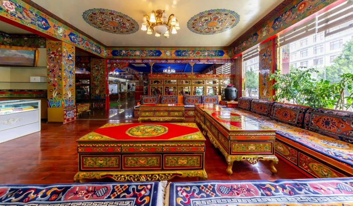 Tibetan style tea lounge with colorful carved tables and seating