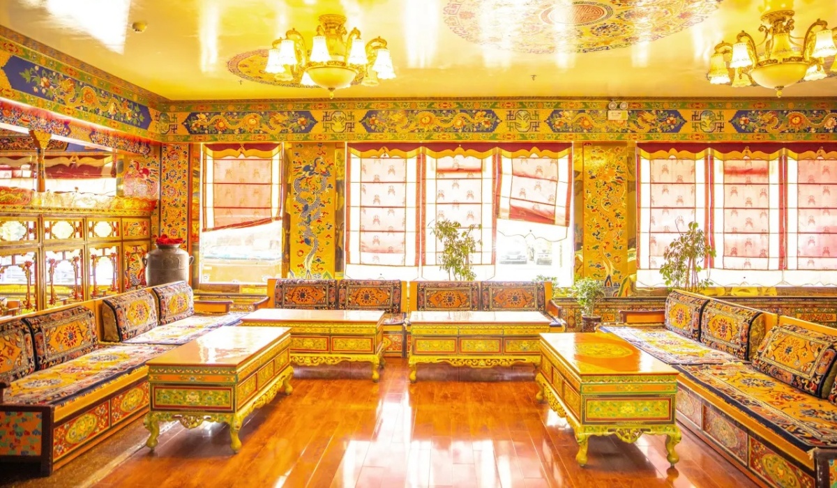 Cozy Tibetan tea lounge seating area with bright yellow ceiling