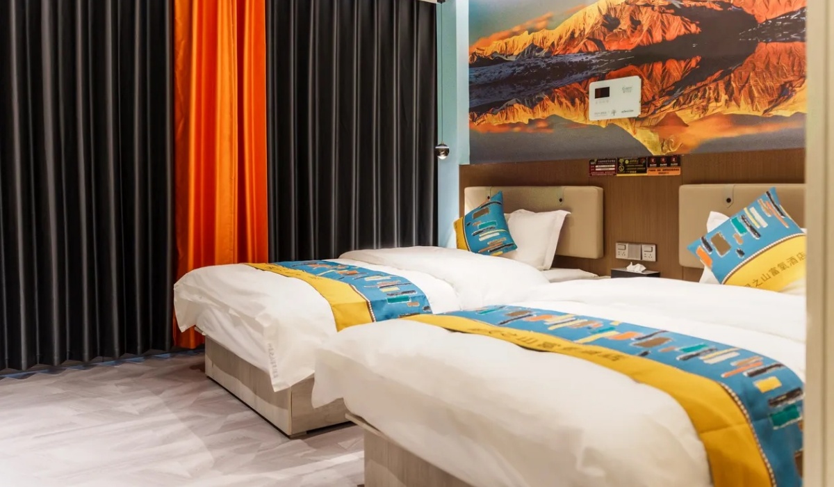 Cozy twin room with Mount Kailash mural at Shenling Mountain Hotel