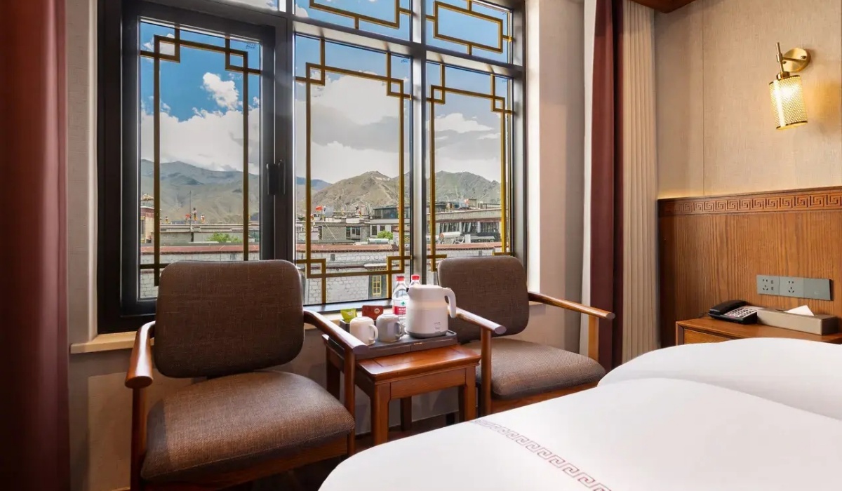 Window seating area in a room at Lhasa Yak Hotel