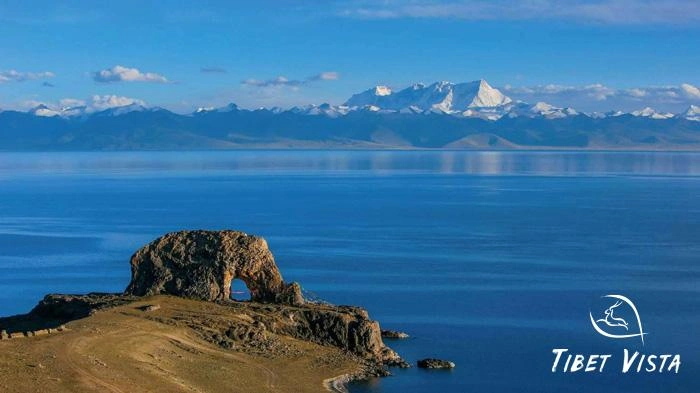 Mt. Nyenchen Tanglha mirrored in the serene waters of Namtso Lake