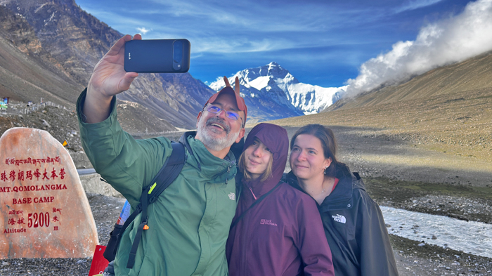 pose for photos with Mount Everest markers at Tibet EBC