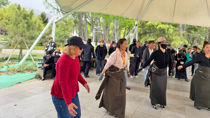 join locals for a traditional dance at Zongjiao Lukang Park in Lhasa