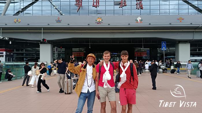 Our Tibetan tour guide present you with a white Hada