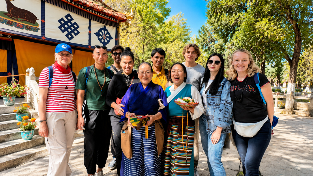 Group photo with Tibetan hosts in Lhasa courtyard.