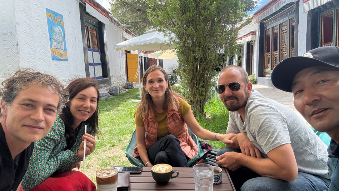 Group photo with Tibetan hosts in Lhasa courtyard.