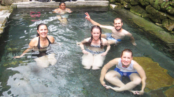 All the tourists enjoy the hot spring in Tibet.