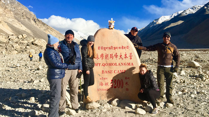 Standing in front of Everest Base Camp Monument