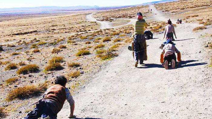 Devout pilgrims are prostrating themselves on the way to Mt. Kailash