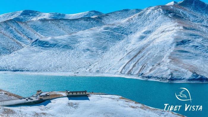 Yamdrok Lake with snow-covered mountains