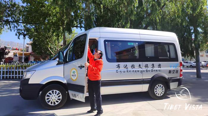Our well-dressed local Tibetans are checking in the tour vehicle