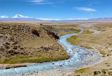 Hike along the stream at the foot of Mount Kailash.