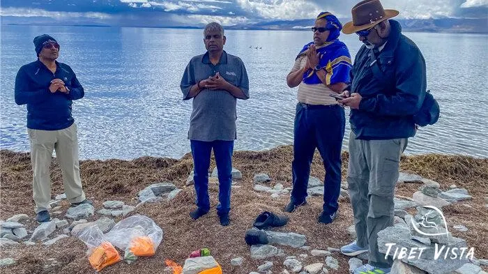 Indian pilgrims perform rituals beside Lake Manasarovar