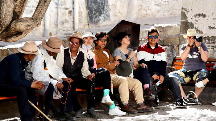 interact with welcoming local Tibetan men
