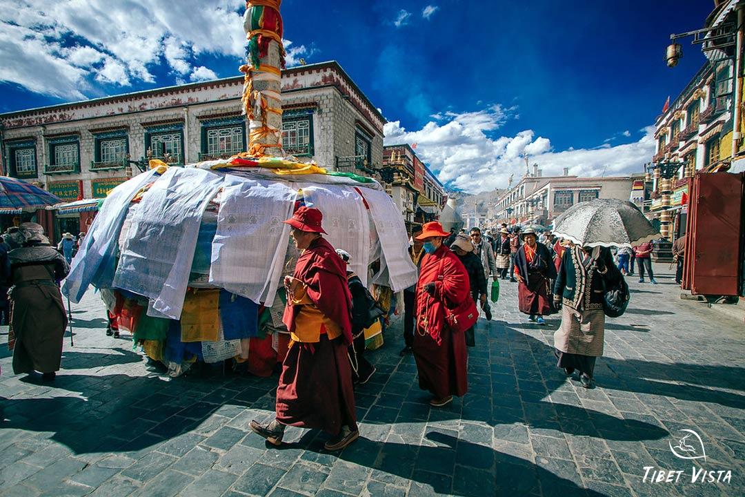 Local Tibetans walk the kora around Barkhor Street