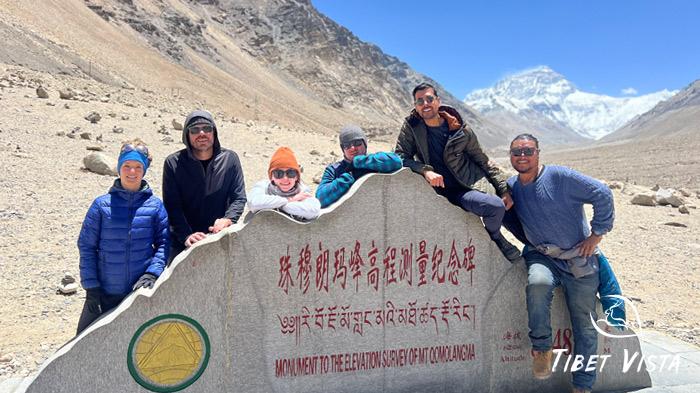 Our guests take photos with Mt. Everest markers at Tibet EBC