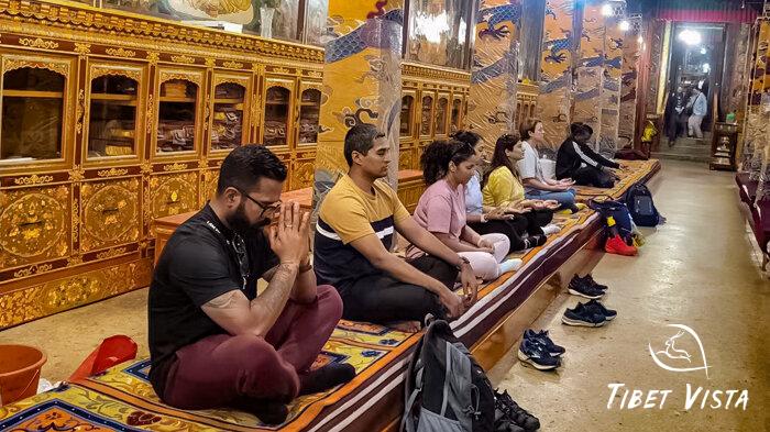 Our guests meditate in the Buddhist halls of Tibetan monasteries