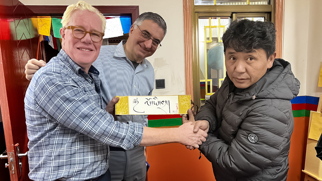 our senior guests learn to write tibetan characters