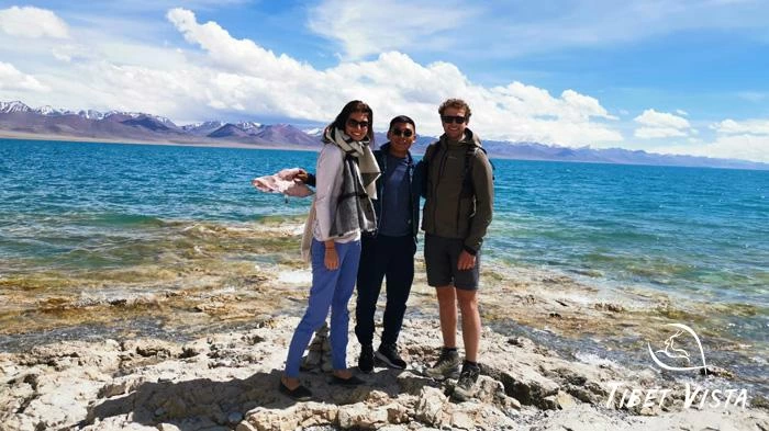 Our beloved guest take pictures along the shore of Lake Namtso