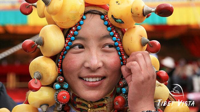 Local Tibetans wearing amber necklaces during a traditional Tibetan wedding