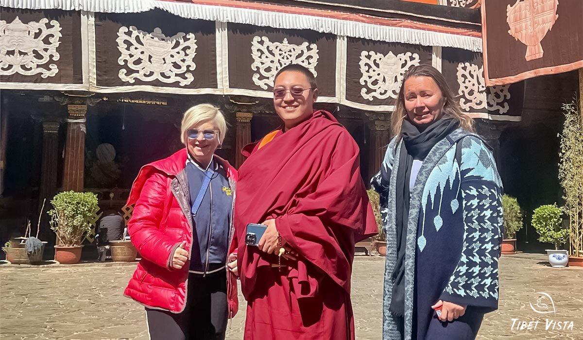 visit jokhang temple courtyard and take photos with tibetan monk